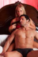weapon, gun, Sexy sensual heterosexual couple, man, young caucasian woman in love on bed kissing, hugging. Beautiful passionate couple is having sex in a bedroom. Portrait of passion, pleasure, sex, relationship. Copulating