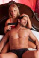 weapon, gun, Sexy sensual heterosexual couple, man, young caucasian woman in love on bed kissing, hugging. Beautiful passionate couple is having sex in a bedroom. Portrait of passion, pleasure, sex, relationship. Copulating