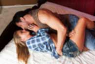 western, cowboy, Sexy sensual heterosexual couple, man, young caucasian woman in love on bed kissing, hugging. Beautiful passionate couple is having sex in a bedroom. Portrait of passion, pleasure, sex, relationship. Copulating