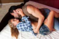 western, cowboy, Sexy sensual heterosexual couple, man, young caucasian woman in love on bed kissing, hugging. Beautiful passionate couple is having sex in a bedroom. Portrait of passion, pleasure, sex, relationship. Copulating