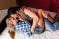 western, cowboy, Sexy sensual heterosexual couple, man, young caucasian woman in love on bed kissing, hugging. Beautiful passionate couple is having sex in a bedroom. Portrait of passion, pleasure, sex, relationship. Copulating