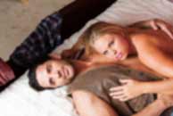 western, cowboy, Sexy sensual heterosexual couple, man, young caucasian woman in love on bed kissing, hugging. Beautiful passionate couple is having sex in a bedroom. Portrait of passion, pleasure, sex, relationship. Copulating