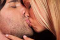 kissing Sexy sensual heterosexual couple, man, young caucasian woman in love on bed kissing, hugging. Beautiful passionate couple is having sex in a bedroom. Portrait of passion, pleasure, sex, relationship. Copulating