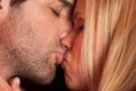kissing Sexy sensual heterosexual couple, man, young caucasian woman in love on bed kissing, hugging. Beautiful passionate couple is having sex in a bedroom. Portrait of passion, pleasure, sex, relationship. Copulating