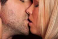 kissing Sexy sensual heterosexual couple, man, young caucasian woman in love on bed kissing, hugging. Beautiful passionate couple is having sex in a bedroom. Portrait of passion, pleasure, sex, relationship. Copulating