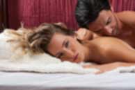 Sexy sensual heterosexual couple, man, young caucasian woman in love on bed kissing, hugging. Beautiful passionate couple is having sex in a bedroom. Portrait of passion, pleasure, sex, relationship. Copulating